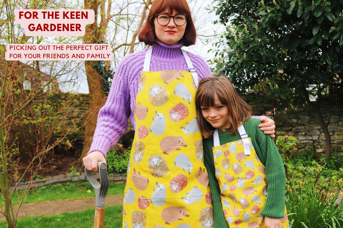 Photo of mother and child in garden wearing Hedgehog design cotton aprons from UmmPixies