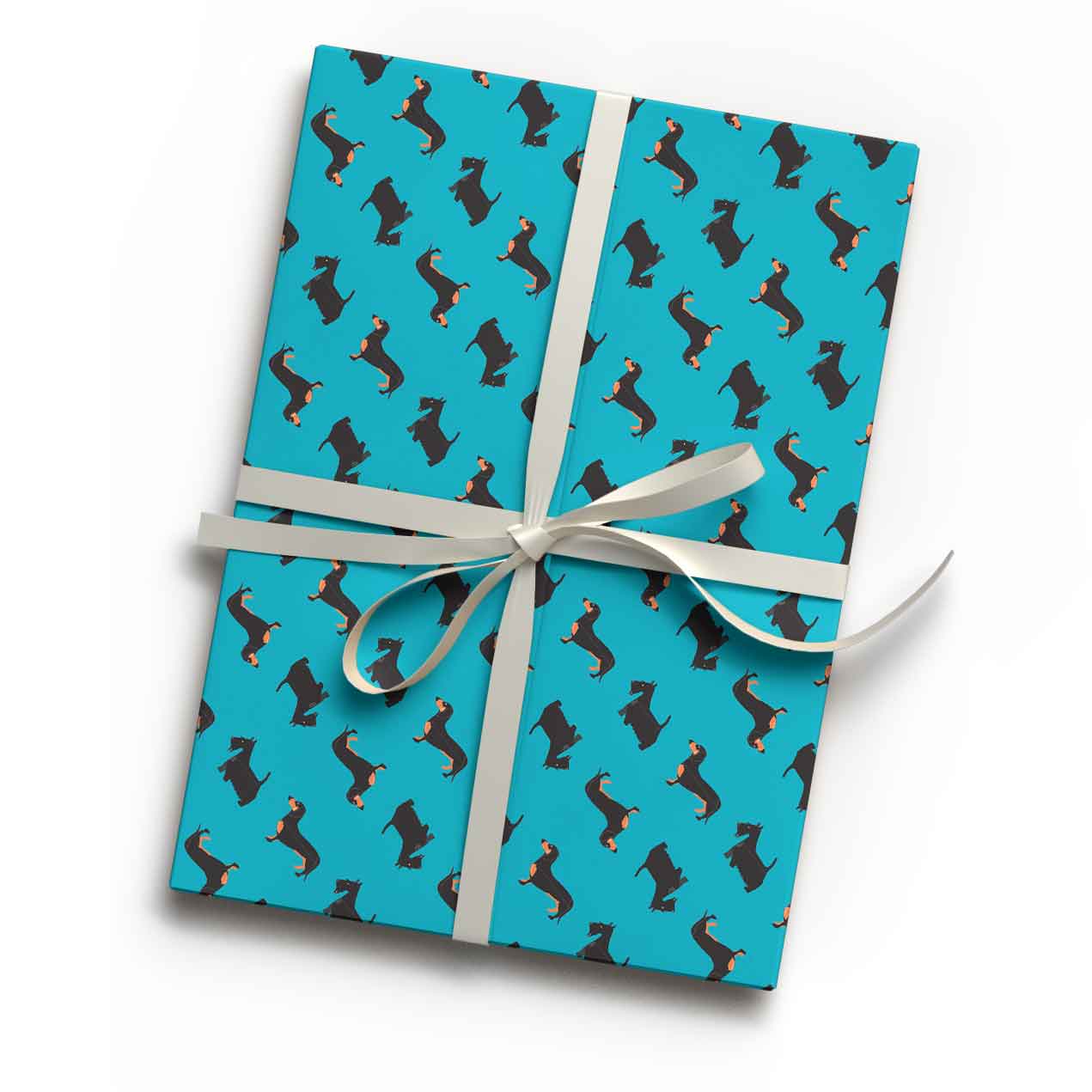 Rich petrol blue dog design animal print luxury gift wrap shown wrapping a gift