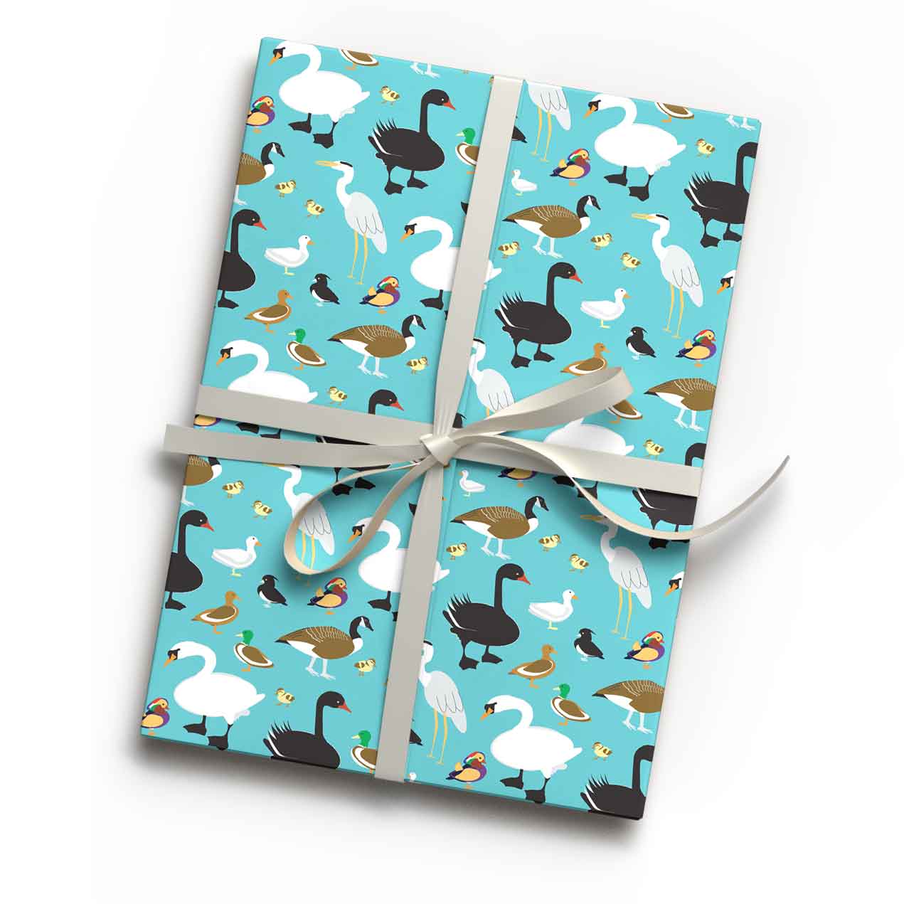 Teal duck and wildfowl bird print luxury gift wrap sheet shown wrapping a gift