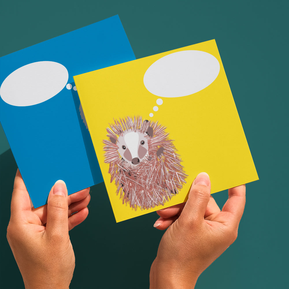 Square yellow hedgehog customisable greetings cards shown held in hand 