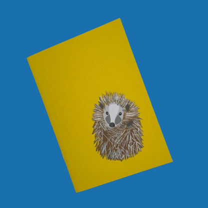 Hedgehog yellow pocket sized notebook with 36 plain pages printed with plant based inks on recycled paper at a local carbon neutral printers