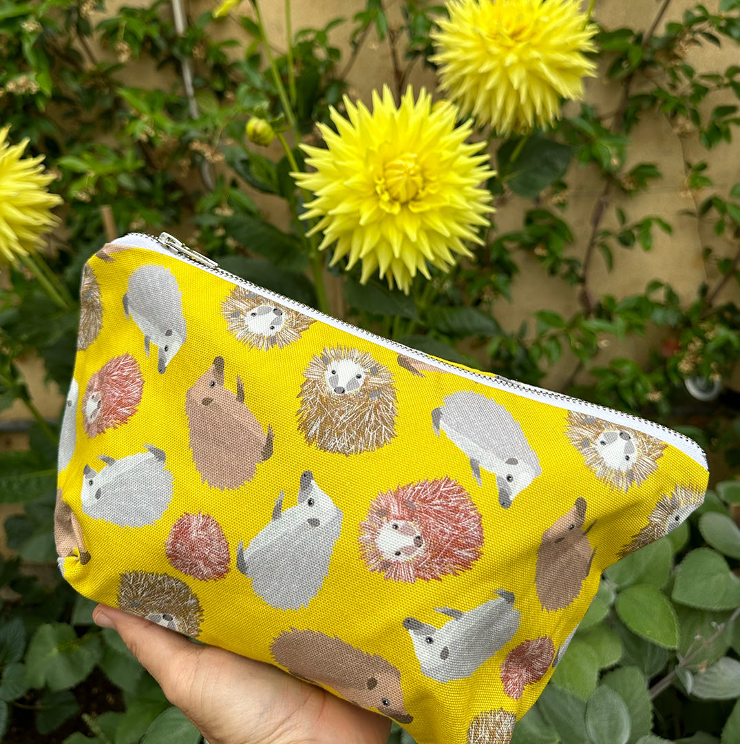 yellow hedgehog bag machine washable organic cotton outer, printed waterproof lining