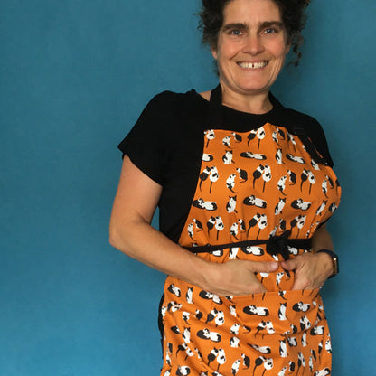 Orange Black and White Cats Design Organic Cotton Apron worn by the designer